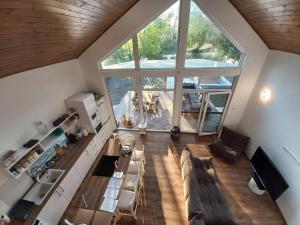 an overhead view of a living room with a large window at Chill House Danzug Gyomaendrőd in Gyomaendrőd