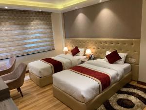 Voodi või voodid majutusasutuse Hotel Flower toas