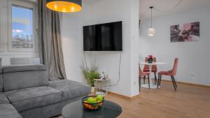 a living room with a couch and a table at Deluxe City AS Apartment - FREE PARKING in Zagreb