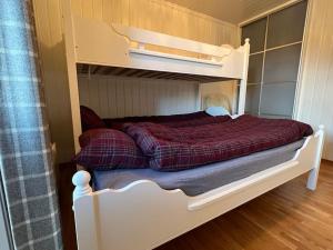 Krevet ili kreveti na kat u jedinici u objektu Leilighet i Uvdal med nydelig utsikt. SKI INN/UT