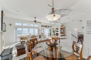 a dining room and living room with a table and chairs at Breathtaking Beach Front House home in St. Augustine