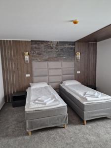 Кровать или кровати в номере Hotel City Break