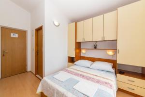 Postel nebo postele na pokoji v ubytování Apartments Palmero
