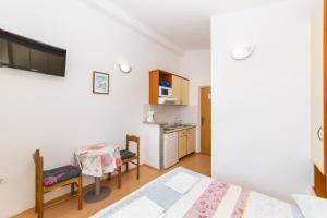 Postel nebo postele na pokoji v ubytování Apartments Palmero