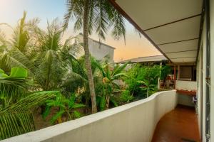 a view from the balcony of a house with palm trees at Sawani Home in Ambalangoda