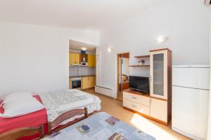 Postel nebo postele na pokoji v ubytování Apartments Palmero