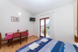 Postel nebo postele na pokoji v ubytování Apartments Palmero
