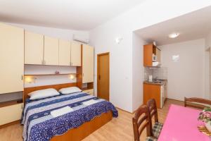 Postel nebo postele na pokoji v ubytování Apartments Palmero