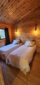 A bed or beds in a room at Chalet Istres des Ardennes