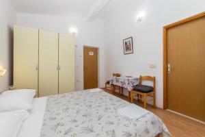 Postel nebo postele na pokoji v ubytování Apartments Palmero