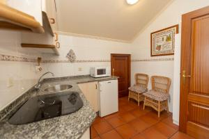 Una cocina o zona de cocina en Escuder Apartamentos Turísticos