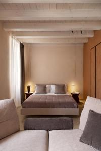 PALAZZO CIOPETA - Italian Excellence tesisinde bir odada yatak veya yataklar