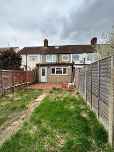 a house with a fence in front of it at 30 min STN or to central London in Enfield Lock