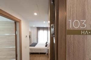 Postel nebo postele na pokoji v ubytování Hostal Boutique Aurora