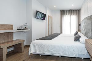 Postel nebo postele na pokoji v ubytování Hostal Boutique Aurora