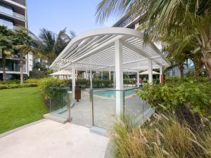 a white pavilion with a pool in a building at New 2 bedroom in Bluewaters with Direct Sea View in Dubai