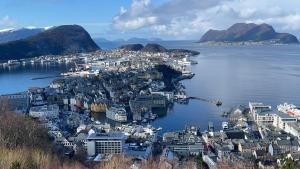 an aerial view of a city on the water at Ytterland Apartments in Ålesund