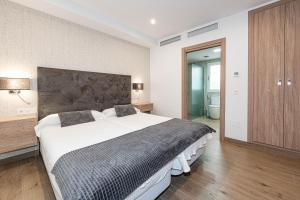 Postel nebo postele na pokoji v ubytování Hostal Boutique Aurora