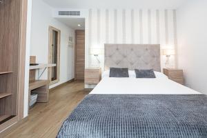 Postel nebo postele na pokoji v ubytování Hostal Boutique Aurora
