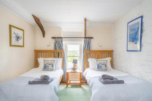 En eller flere senge i et værelse på Llety Newport, Pembrokeshire