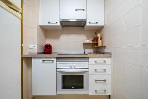 Kuchyň nebo kuchyňský kout v ubytování Hauzify I Apartaments Reddis