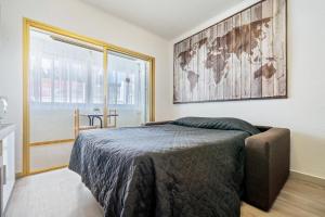 Postel nebo postele na pokoji v ubytování Hauzify I Apartaments Reddis