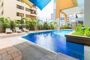 a swimming pool in the middle of a building at Duplex Condominium In Bukit Bintang For Rent in Kuala Lumpur