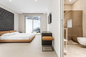 Ένα ή περισσότερα κρεβάτια σε δωμάτιο στο Villa Tritone +25 φωτογραφίες