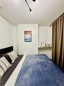 Katil atau katil-katil dalam bilik di Comfy Condo in Malate for 4 - Admiral Baysuites