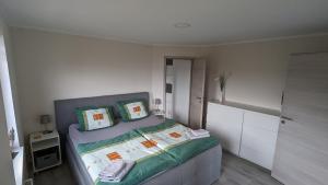 En eller flere senge i et værelse på Über den Dächern von Eisenach