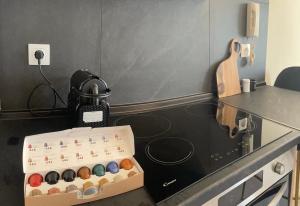 a glass counter top with a box of buttons at Casa D'oro Α2 in Larisa