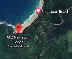een kaart van een strand met een rode markering bij A&Z Nagtabon Lodge in Bacungan