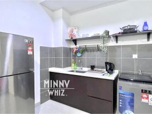 a kitchen with a sink and a refrigerator at MRT Balcony Netizen Couple Friendly #29 in Cheras