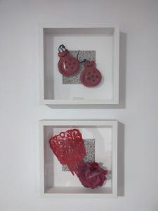 two framed pictures of a ladybug on a wall at Apartamento Gitanilla in Chipiona +24 photos