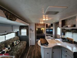 a living room and kitchen of an rv at Harrison Rv Sanctuary, Pool, Hot tub, 2 Bedrooms in Harrison Hot Springs