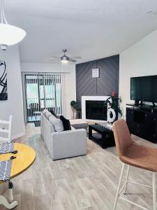 a living room with a couch and a table at Urban Oasis Getaway in Jacksonville