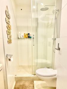 a bathroom with a shower and a toilet at Hotel Apartment with Breathtaking Panoramic Sea and Mountain Views in Palma de Mallorca