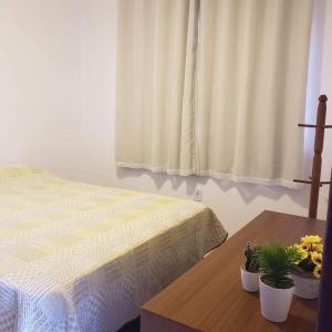Postel nebo postele na pokoji v ubytování Village Jardins