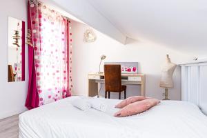 a bedroom with a bed with a desk and a chair at Villa Van Gogh in Saint-Martin-de-Crau +29 photos