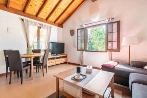 a living room with a couch and a table at Casa Simón in Fátaga