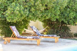 two lounge chairs sitting next to a pool at Villa Van Gogh in Saint-Martin-de-Crau
