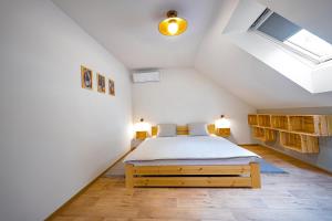 Postel nebo postele na pokoji v ubytování Rodinné vinařství Turzík