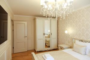 Postel nebo postele na pokoji v ubytování Boutique Apartments Klaipedas + 3 fotografie