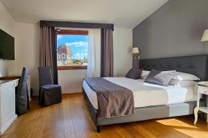Postel nebo postele na pokoji v ubytování Hotel Atlantic Palace
