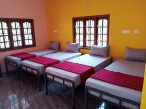 A bed or beds in a room at HostelVK Gokarna