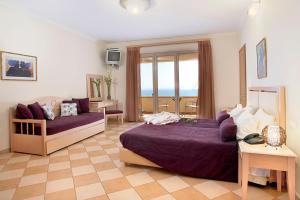 A bed or beds in a room at Sea View Resorts & Spa