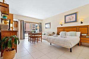 a bedroom with a bed and a living room at Solana Fuengirola 40 in Fuengirola +20 photos