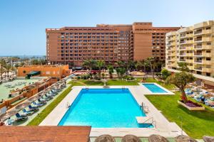 an aerial view of a resort pool with buildings at Solana Fuengirola 40 in Fuengirola