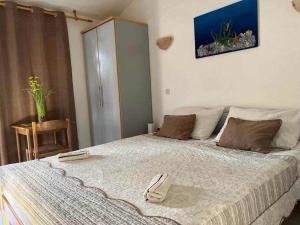 Posteľ alebo postele v izbe v ubytovaní Apartments Natalika