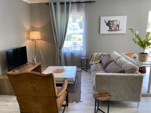 TV a/nebo společenská místnost v ubytování Marble Maison